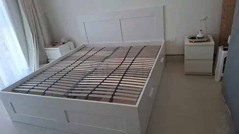 White wooden queen size bed frame with 4 storage drawers - good condition