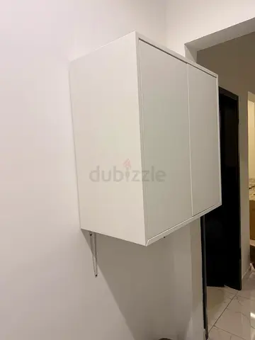 Wall-mounted white cabinet with two doors
