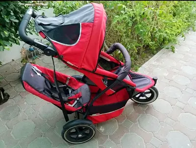 Phil & Teds Stroller Red three-wheel jogging stroller in good condition