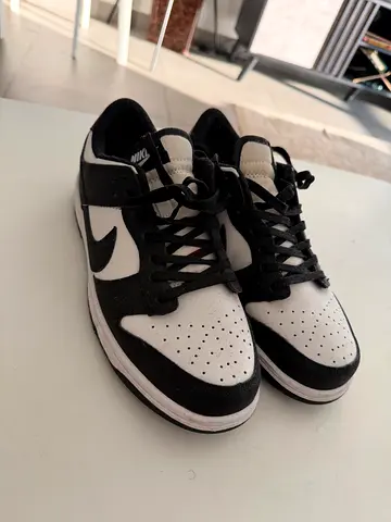 Used black and white low-top sneakers, good condition