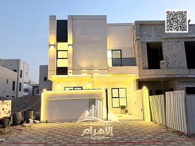 Villa for sale, located on a main road. The property consists of two floors and a roof, featuring 5 master bedrooms. It is situated next to the mosque