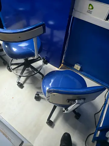 3 blue adjustable swivel stools with backrests