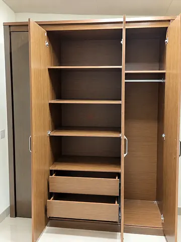 Four-door wooden wardrobe with shelves and drawers