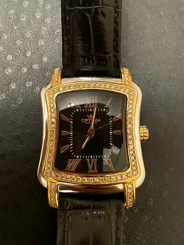 Men's Optima gold-tone watch with crystal bezel, black leather strap