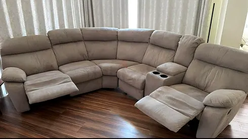 Large U-shaped reclining fabric sofa with cup holders — light brown