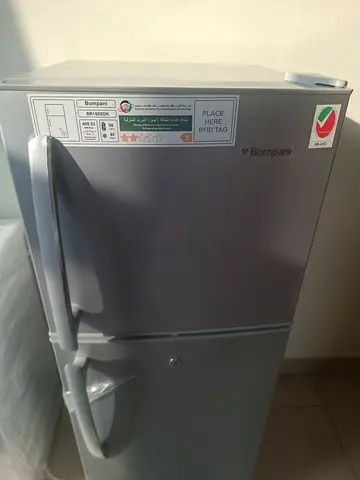 Compact two-door refrigerator in good working condition