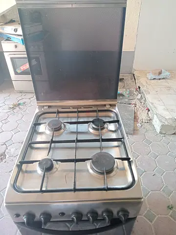 Used 4-Burner Stainless Steel Gas Cooker with Oven - Good Working Condition