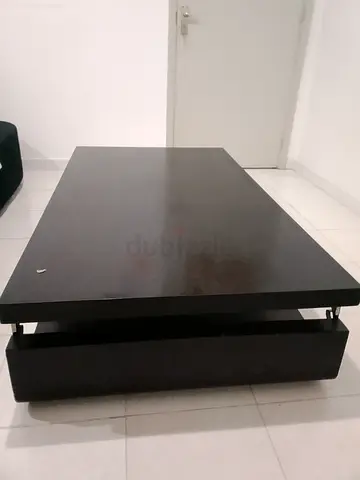 Dark wood low coffee table with storage drawer