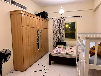 Large Wooden Wardrobe with Double Beds in Furnished Bedroom
