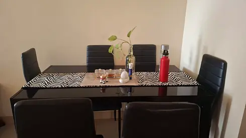 Black glass dining table with 6 black chairs - good condition