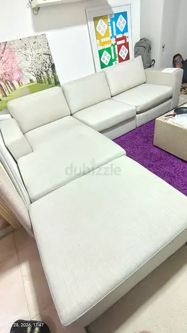 Light grey L-shaped sectional sofa in good condition
