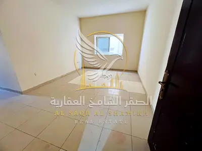 Two-bedroom apartment with a living room for rent in Al Naba'a, Sharjah. It features two bathrooms and central air conditioning, with maintenance prov