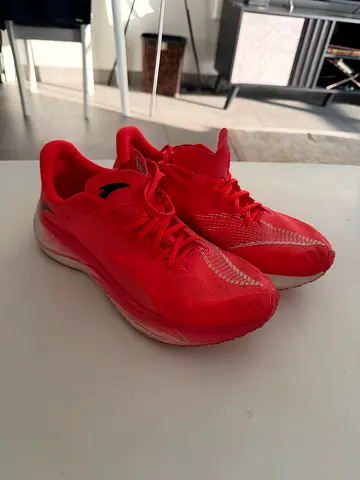 Used red running shoes - size not specified, comfortable midsole