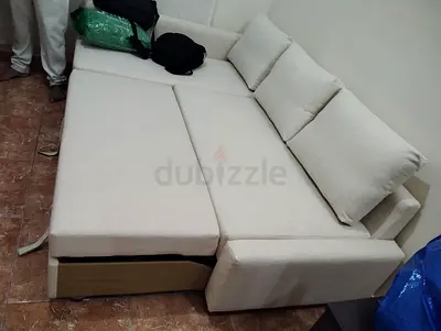 L-shaped beige fabric sofa bed, good condition