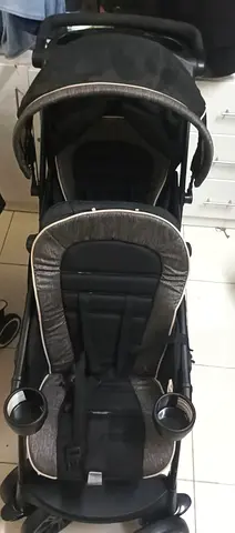 Used double-seat baby stroller with cup holders - good condition