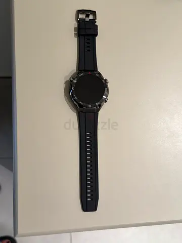 Used smartwatch with round display and silicone strap - very good condition
