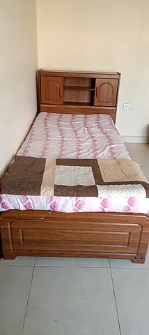 Wooden cot with cupboard and mattress