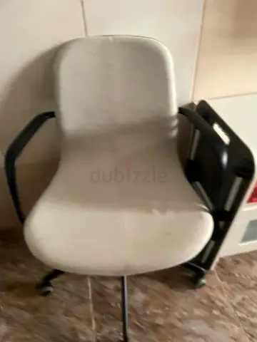 White ergonomic swivel office chair with casters