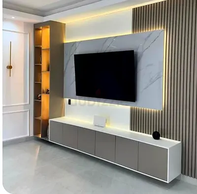 Modern built-in TV entertainment unit with LED lighting and storage