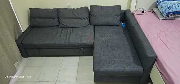 L-shaped grey fabric sofa with storage — good condition