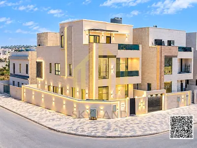 Luxury villa for sale in Al Helio 2, featuring a swimming pool and spanning 3 floors. Located next to the Azha complex, it includes 5 bedrooms and boa