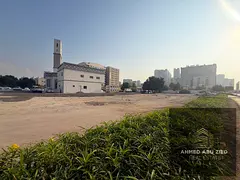 Residential/commercial corner plot on 3 streets opposite Ajman Markets Association on a main street,