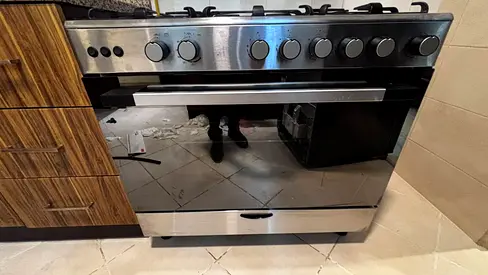 Stainless Steel 5-Burner Gas Cooker with Built-in Oven - Good Condition