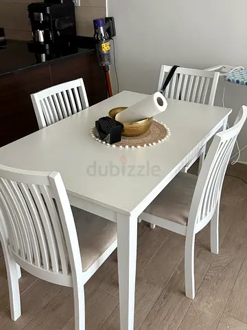 White wooden dining table with 4 matching chairs - good condition, purchased from Danube shop