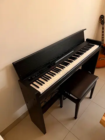 KORG Digital piano with bench in good working condition original price :4,099 aed