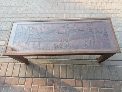 Hand-carved Malaysian coffee table with glass top