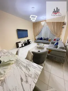 Sharjah Al Taawun, two-bedroom apartment, hall, kitchen, two bathrooms and balcony