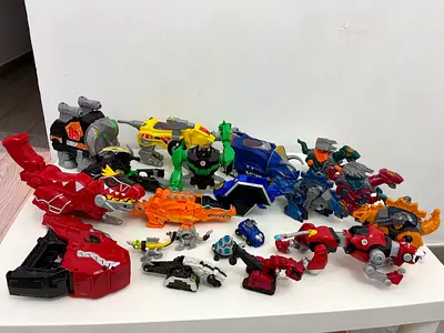 Mixed collection of kids' action figures and transforming toy vehicles