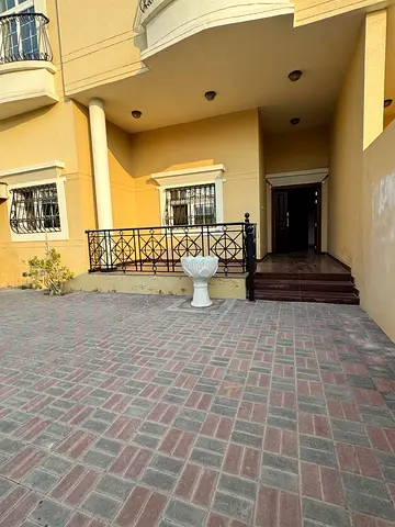 Villa for annual rent in Sharjah: 4BR, majlis, maid's room, private garden, free gym & pool, 5 indo