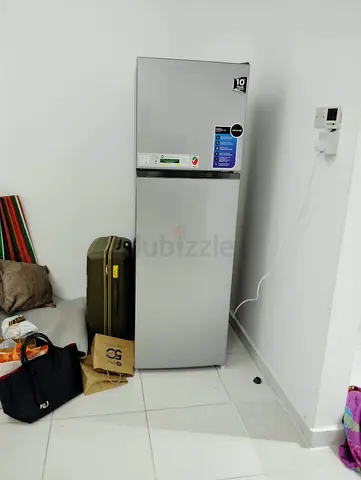 Silver double-door refrigerator - good working condition