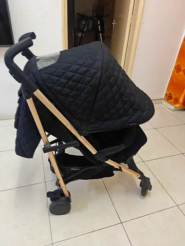 Lightweight compact stroller with quilted canopy – good condition location sharjah