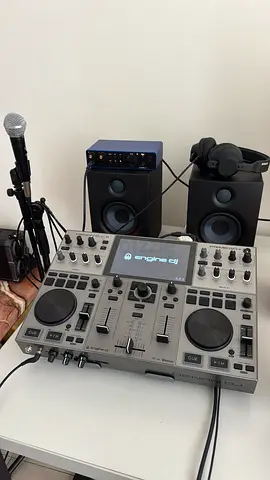 DJ Controller setup with speakers, audio interface and microphone