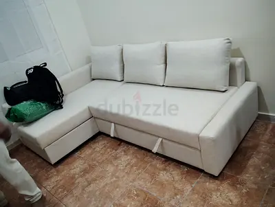 Light Beige L-shaped Sofa Bed with Storage — Good Condition