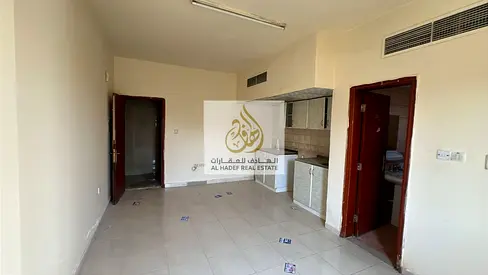 Studio for Annual Rent in Al Rawda 1 | Opposite Kenz Hypermarket | Balcony & Central AC