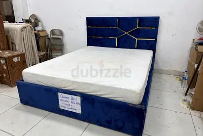 Queen upholstered bed frame with headboard - navy blue, good condition