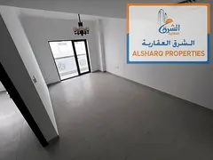 First-time occupancy: 2 bedrooms, living room, 3 bathrooms, and a balcony. Located in Al Hamidiya 1.