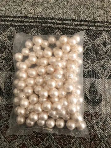 Bag of white faux pearl beads for arts and crafts