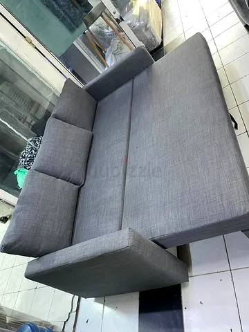 Grey fabric sofa bed - convertible 3-seater in good condition