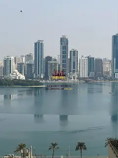 2BR apartment in Al Khan, Sharjah. Sea view, panoramic windows, central AC, 2 bathrooms. AED 38,000/