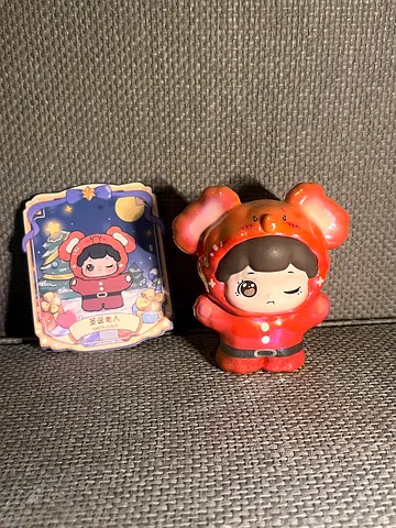 Cute collectible squishy toy figure with matching sticker/card