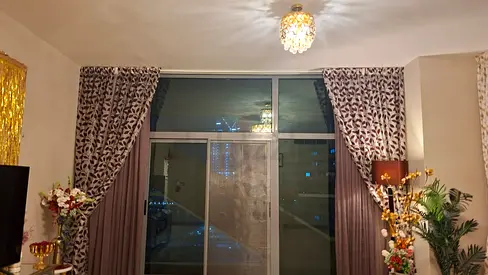 Pair of patterned full-length curtains with blackout lining