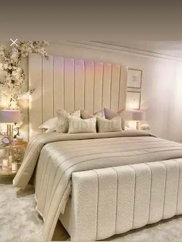 Beige upholstered bed frame with tall channel-tufted headboard (double/queen)