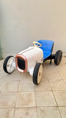 Vintage-style child pedal car - classic ride-on in good used condition