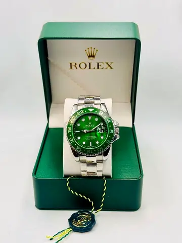 Rolex stainless steel green dial watch in original box