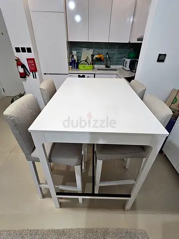 White Wooden Dining Table with 4 Upholstered Chairs