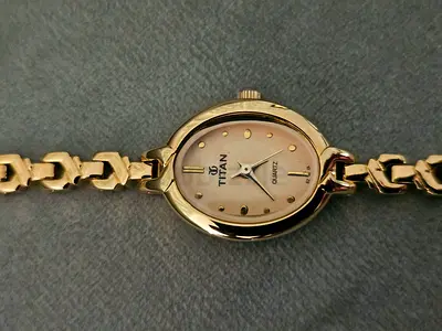 Titan Gold-Tone Women's Quartz Bracelet Watch - Elegant Small Dial
